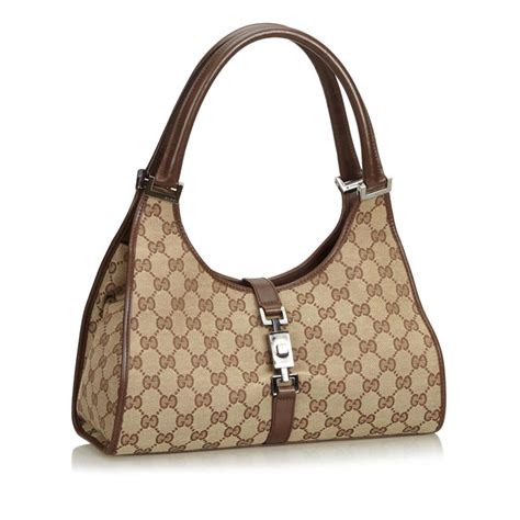 gucci gg bag with push lock closure nd interior pocketa
